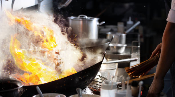 istock Chef stir fry cooking 1313539229