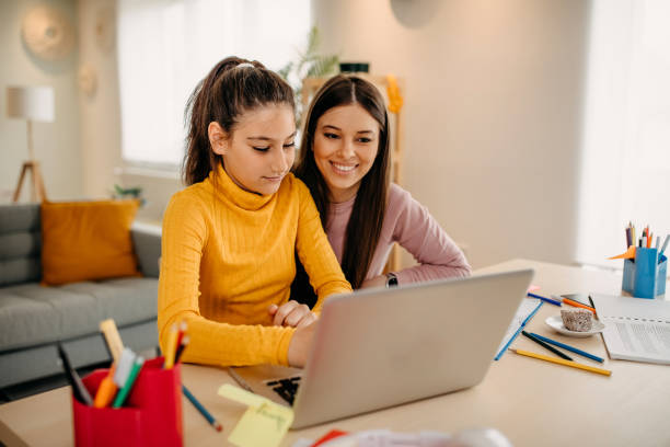 Mother is helping daughter with homework
