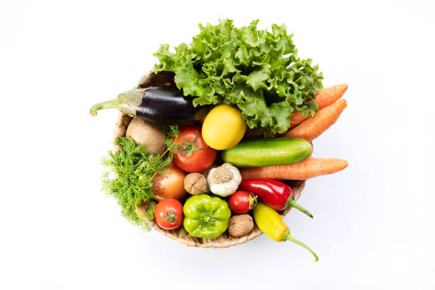 istock Fresh Vegetables in basket on white isolated background top view. 1313544423