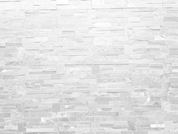 istock Rough white stone wall background in vintage style for graphic design 1313548488