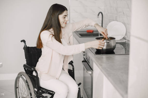 istock Disabled Young Woman Cooking In Her Kitchen 1313548625