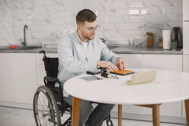 istock Young disabled man repairing motherboard at kitchen 1313548639