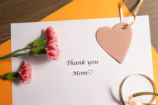 Mother's Day message card with carnation flowers.