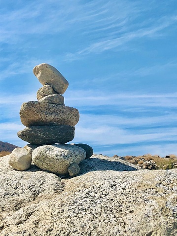 Stacked Rock Cairn on a hiking trail in the desert