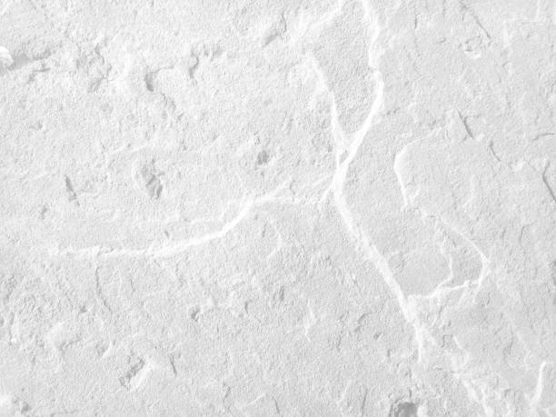 istock Rough white stone wall background in vintage style for graphic design 1313550821