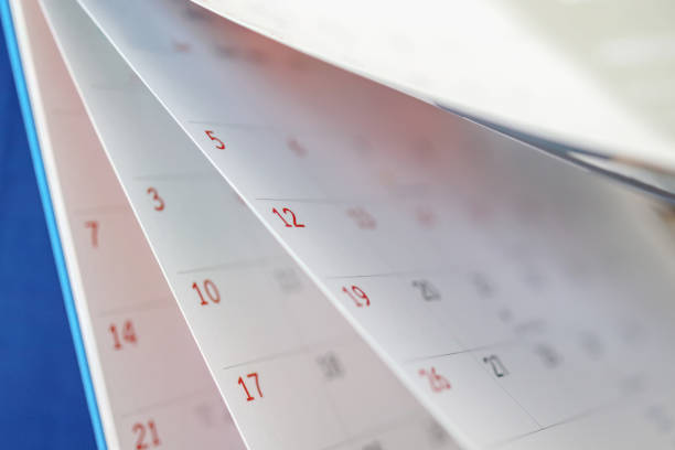 istock Calendar page flipping sheet close up on office table interior background business schedule planning appointment meeting concept 1313556056