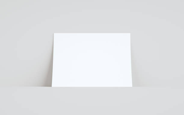 istock A4 Flyer / Letterhead Mock-Up - One Flyer Against Wall Background 1313556913