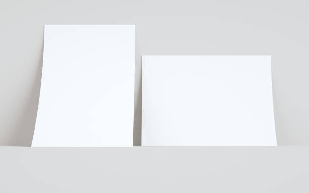 istock A4 Flyer / Letterhead Mock-Up - Two Flyers Against Wall Background 1313556919