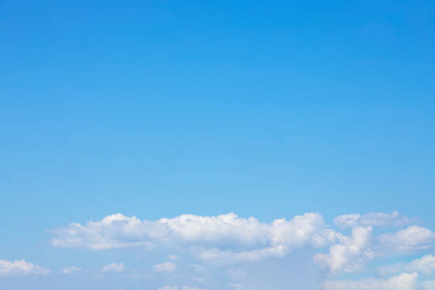 istock Blue sky background and white clouds soft focus, and copy space 1313557460