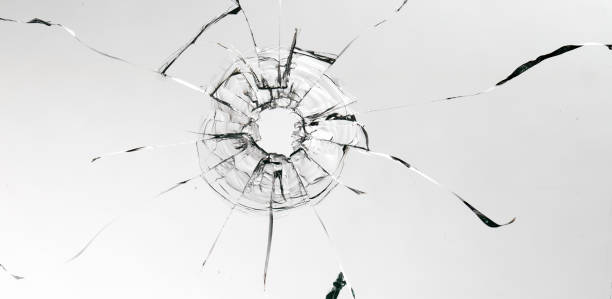 istock Cracks on the glass on a white background. 1313560648