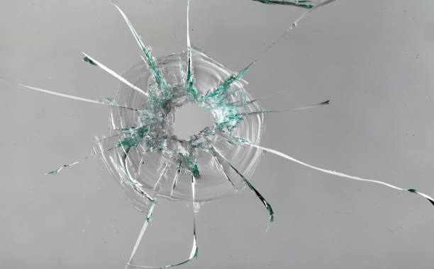 istock Cracks on the glass on a white background. 1313560654