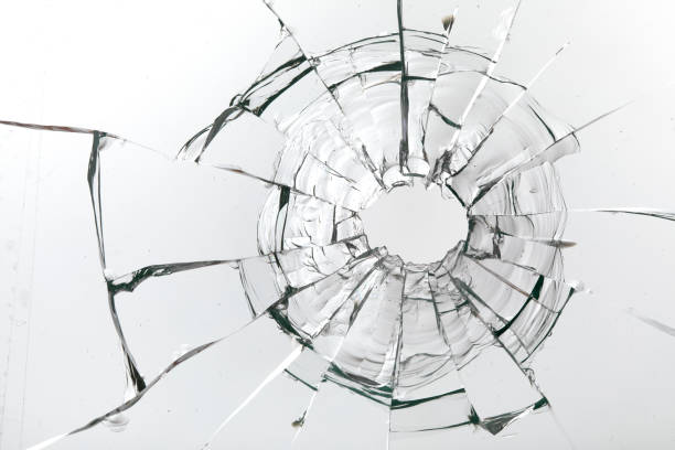 istock Cracks on the glass on a white background. 1313560655