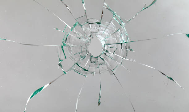 istock Cracks on the glass on a white background. 1313560658