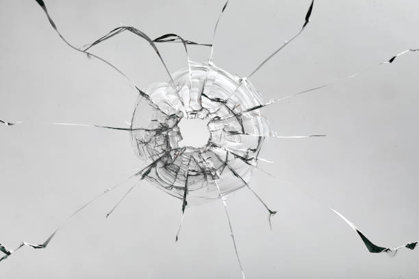 istock Cracks on the glass on a white background. 1313560672