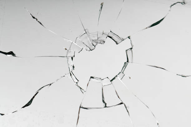 istock Cracks on the glass on a white background. 1313560679