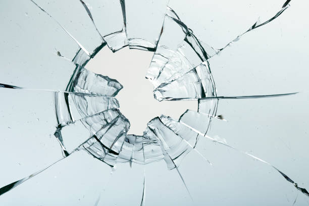 istock Cracks on the glass on a white background. 1313560684