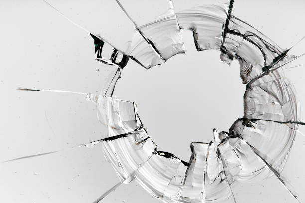 istock Cracks on the glass on a white background. 1313560685