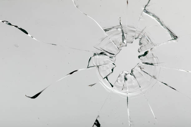 istock Cracks on the glass on a white background. 1313560686