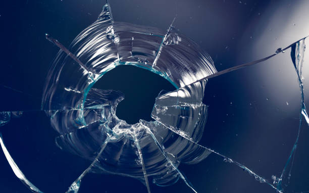 istock Cracks in the glass on a dark background. 1313560697