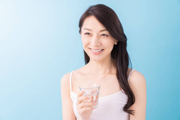 istock attractive asian woman who drinks water 1313561717