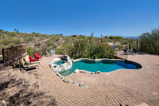 istock Swimming pool with terraced patio 1313562317