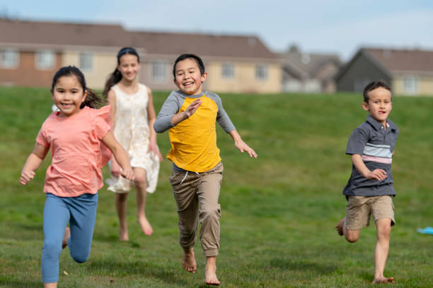 istock Happy group of kids running 1313564661