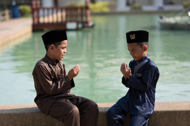 Muslim boy praying Muslim boy praying allah stock pictures, royalty-free photos & images