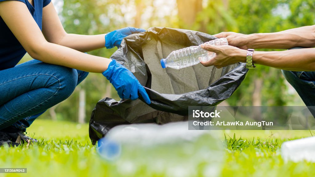 Collect garbage in the ecological group park. Concept of environmental protection. Team up with external recycling projects Garbage Stock Photo