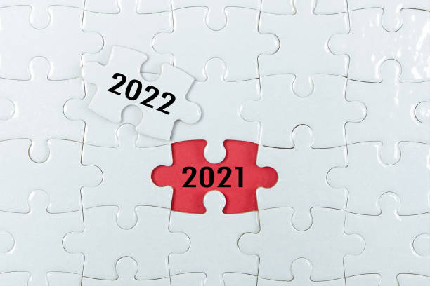 istock 2021, 2022 on puzzle background, business concept. 1313569209