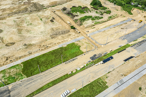 new road under construction. construction site during earthworks progress. aerial view