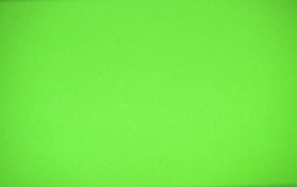 istock Acid green monochrome surface with rough texture and close-up vignetting. 1313572474