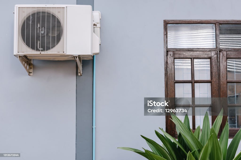 Home Cooling Air Condition Unit and Control System, Air Condenser Engine Station Outside Building of HVAC Systems. Electrical Compressor Fan Coil of Air Conditioning Equipment for Home Residential. Fan - Enthusiast Stock Photo