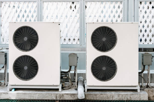 istock Cooling Air Condition Unit and Control System, Air Condenser Engine Station Outside Building of HVAC Systems. Electrical Compressor Fan Coil of Air Conditioning Equipment for Home Residential Units. 1313573384