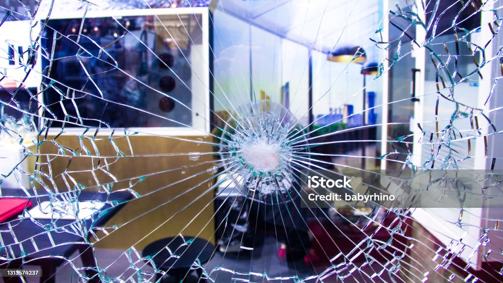 Bulletproof glass for home and office wall. Bullet resistant glass. House material for safety and protection. Anti Thief, resistant to penetration curtain wall.  Concept image for crime investigation. Violence Stock Photo