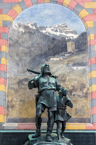 Altdorf, Switzerland - Aprill 20, 2021: Statue (from 1895) of William Tell and his son at the Rathausplatz (City Hall Square) of Altdorf, Switzerland. square. Wilhelm Tell, the Swiss folk hero against the Austrian dukes of tHabsburg in the early 14th century