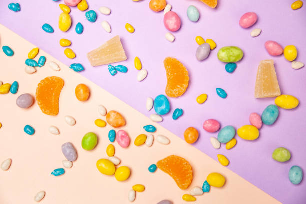 istock Various colorful sweets scattered on table on colorful background 1313577033