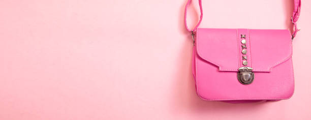 istock Pink leather handbag on pink background. 1313580652