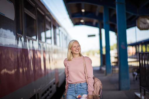 Young woman on train station.