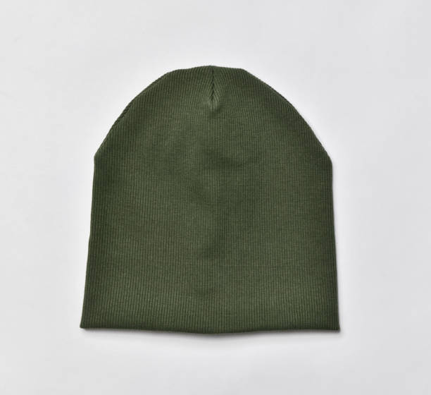 istock Green modern knitted beanie hat, knitwear isolated on white 1313584004