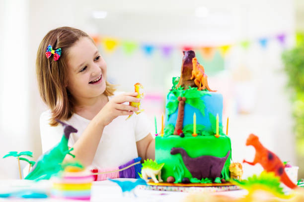 istock Kids birthday party. Dinosaur theme cake. 1313585277