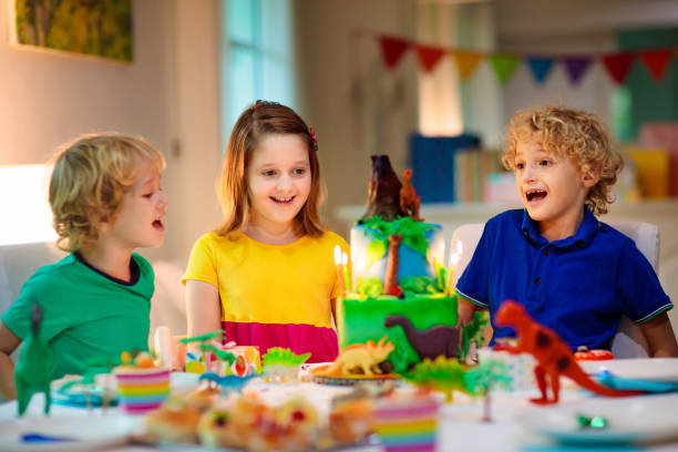 istock Kids birthday party. Dinosaur theme cake. 1313585345