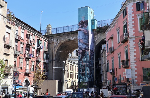 Naples, Campania, Italy - April 8, 2021: Murals TIENEME CA TE TENGO by Filipino artist Jerico Cabrera Carandang on the lift of the Sanità Bridge
