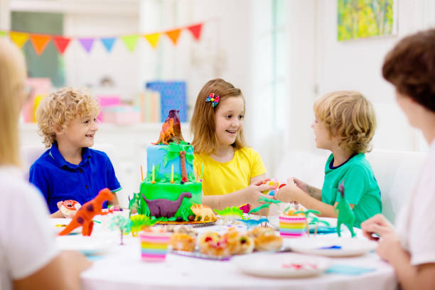 istock Kids birthday party. Dinosaur theme cake. 1313585931