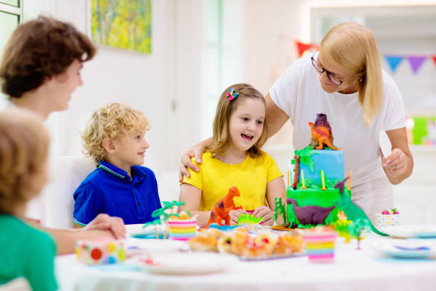 istock Kids birthday party. Dinosaur theme cake. 1313586021