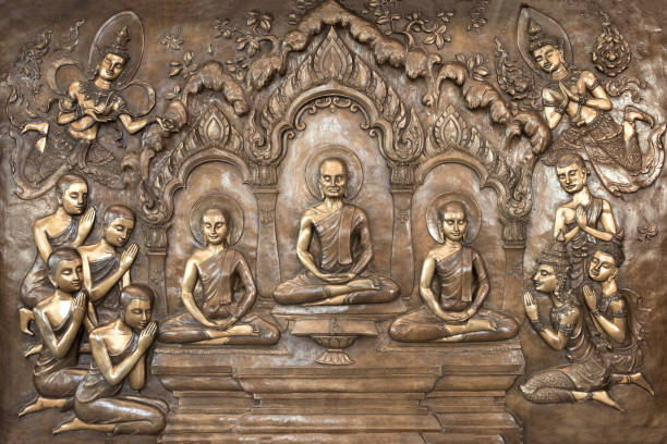 istock Buddha statues on temple wall in Thailand 1313588070