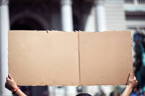 istock Protesters holding placards and signs on the streets. 1313588244