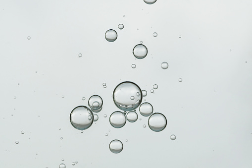 Light water bubbles over a gray background