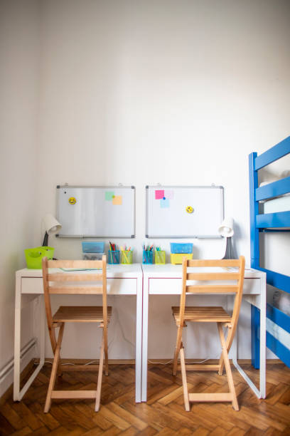 istock Desk with learning supplies at the kids room 1313589033