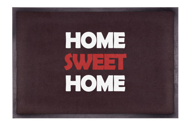 istock Modern black doormat isolated on white - Home sweet home 1313589503