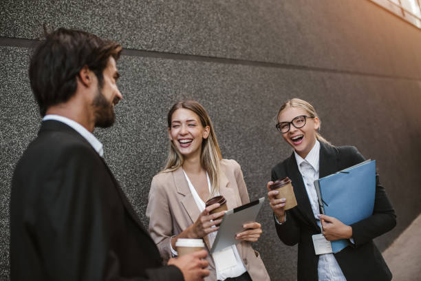 istock Office colleagues talking outdoors near the office building 1313590345